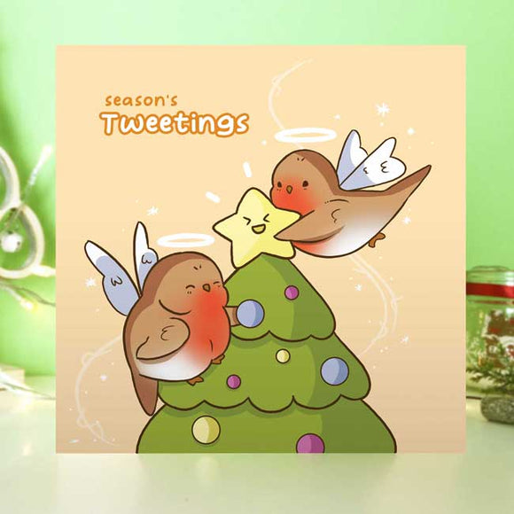 Christmas card with seasonal bird-themed design and festive greeting.