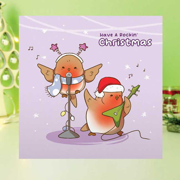 Christmas card featuring a robin with festive, musical elements.