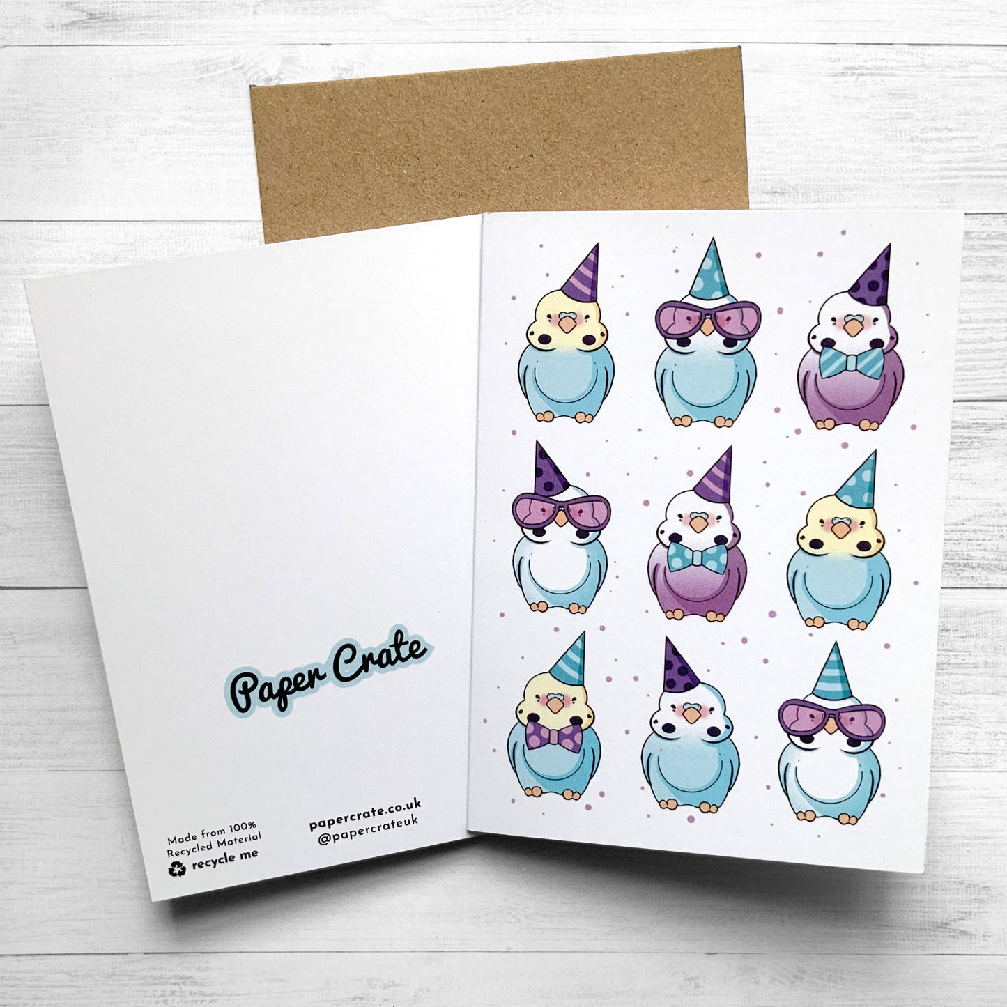 Colorful birthday card featuring budgies wearing tiny hats and bows.