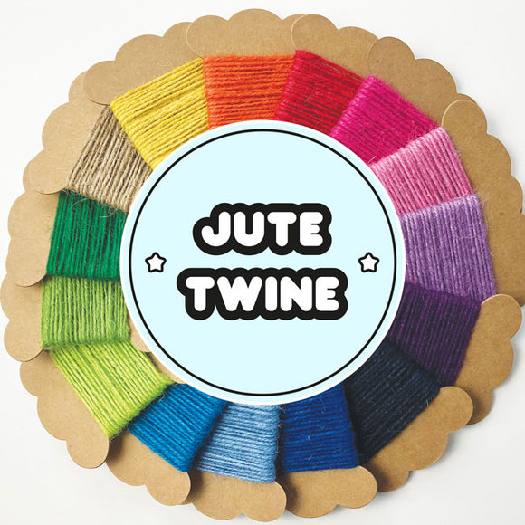 A coloured circle of jute twine bobbins