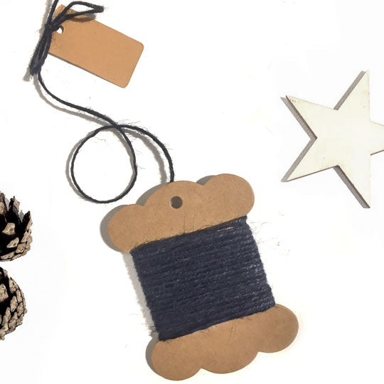 Roll of navy blue jute twine for crafting and tying.