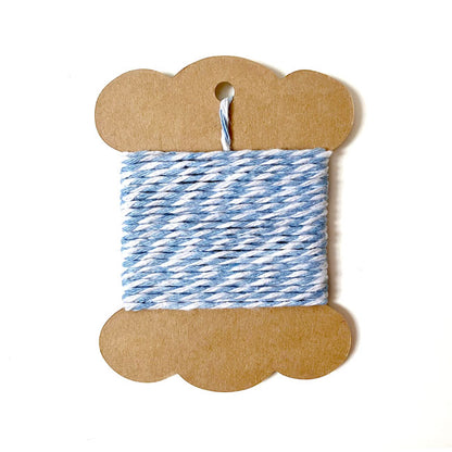 Sky blue and white striped bakers twine spool.