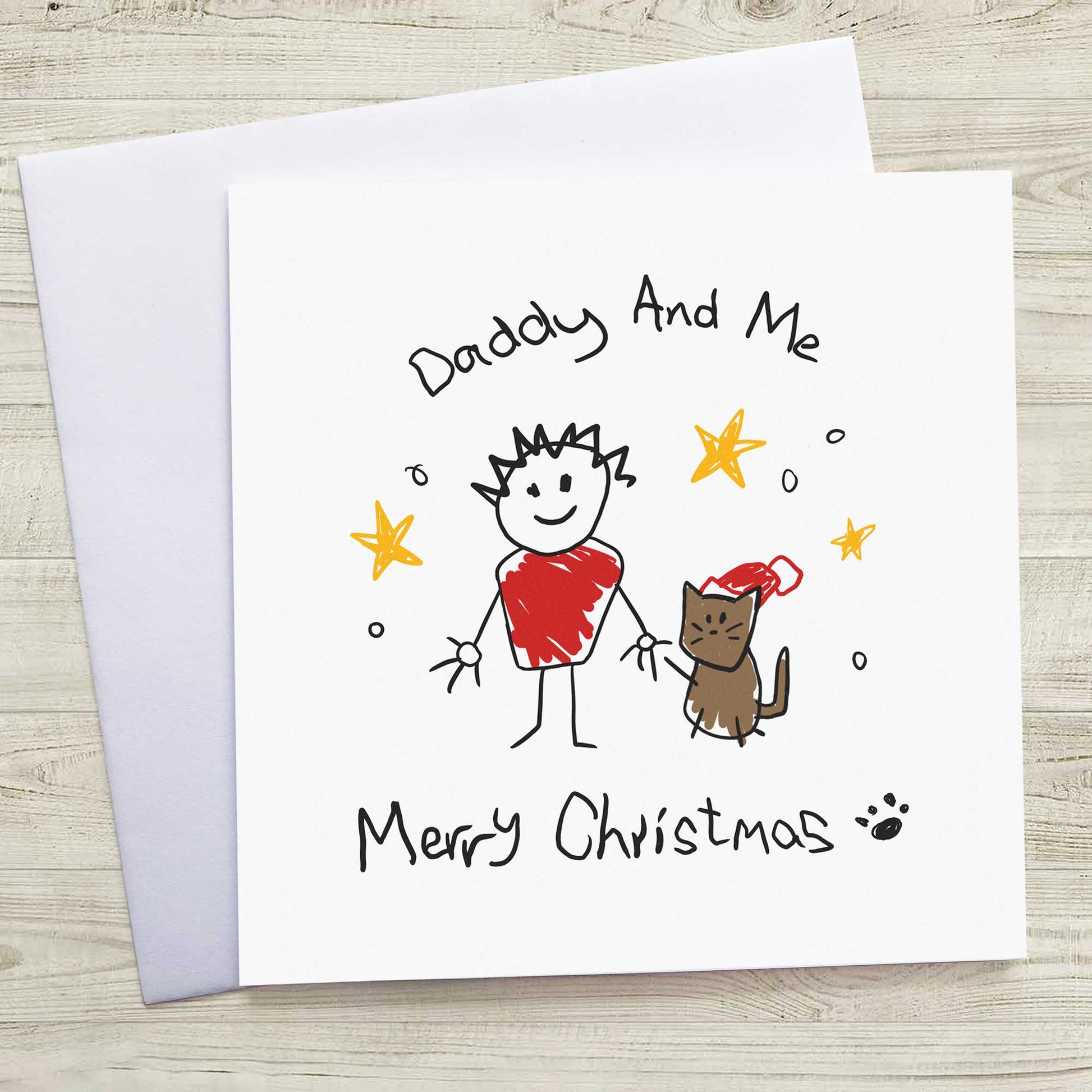 Christmas card with a child's drawing of a person and a cat, titled 'Daddy And Me Merry Christmas'.