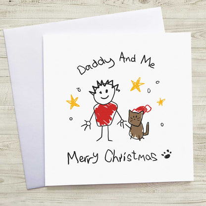 Christmas card with a child's drawing of a person and a cat, titled 'Daddy And Me Merry Christmas'.