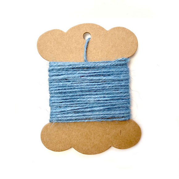 Roll of baby blue jute twine for crafts and packaging.
