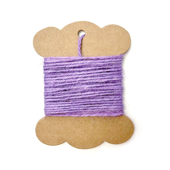 Roll of lilac-colored jute twine for crafting and wrapping.