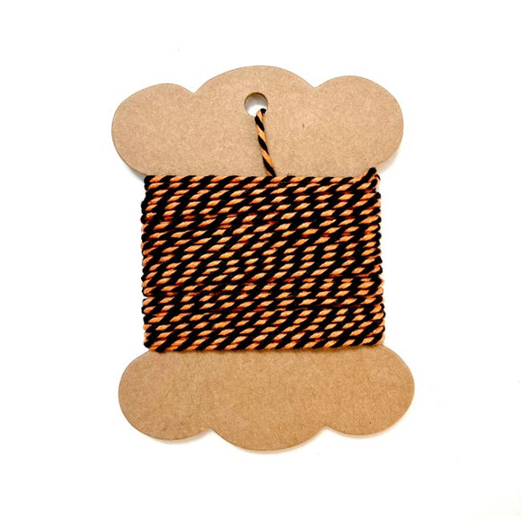 Orange and black striped twine for baking and crafting.