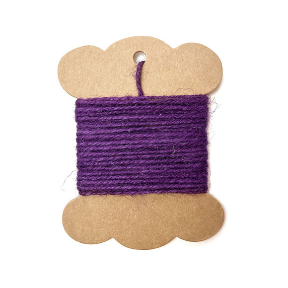 Roll of purple jute twine for crafting and wrapping.