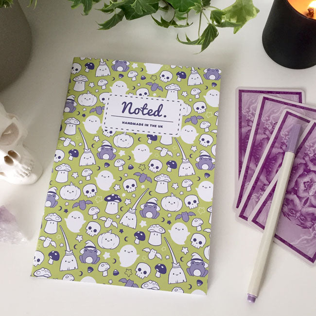Notebook with spooky yet adorable Halloween-themed illustrations on the cover.