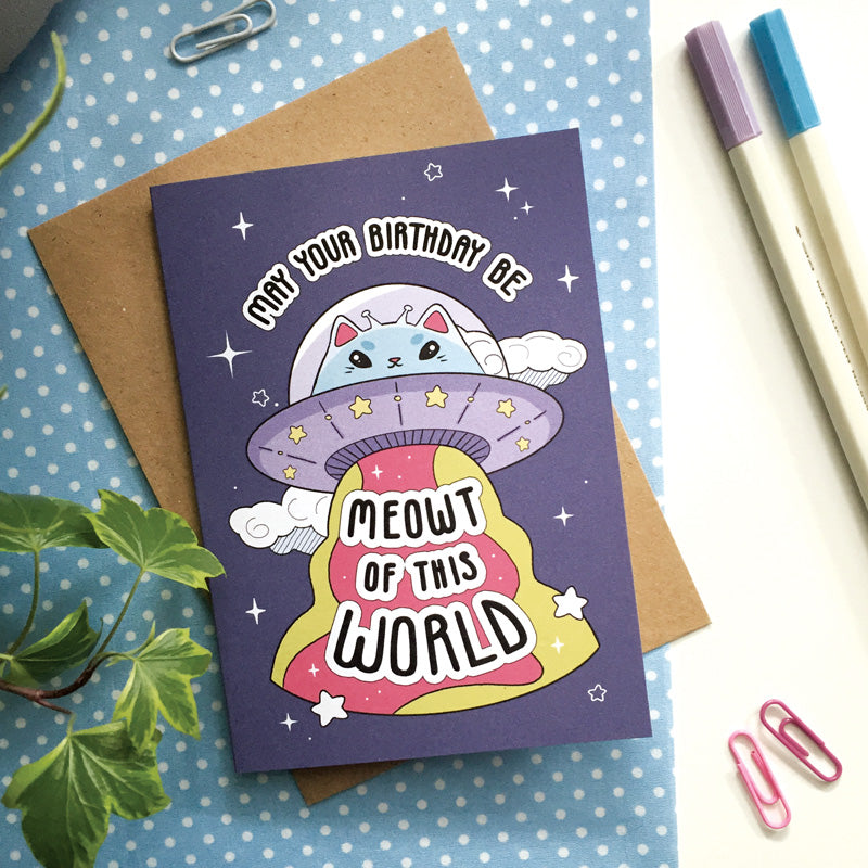 Whimsical space-themed birthday card with a cat in an astronaut suit.