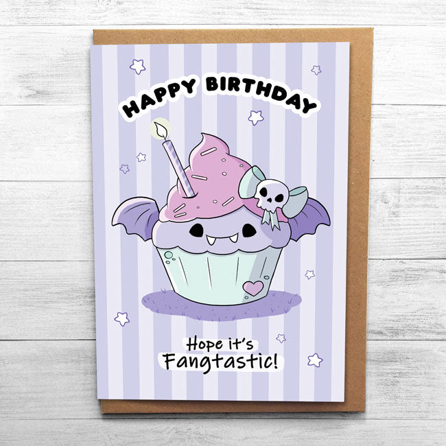 Halloween-themed birthday card with vampire fangs design.
