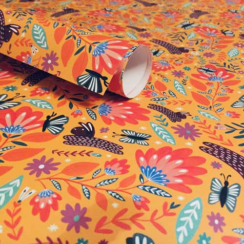 Eco-friendly wrapping paper with folk art bunnies and butterflies.