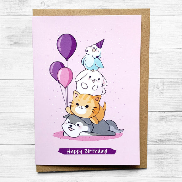 Pink birthday card featuring cute animals celebrating a party.