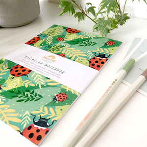 A5-sized notebook with a ladybird-themed cover design.