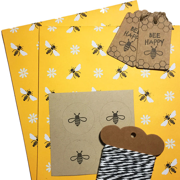 Eco-friendly bee-patterned paper set for sustainable gift wrapping.