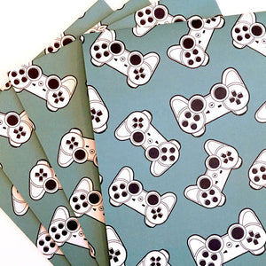 Eco-friendly wrapping paper with game controller pattern design.