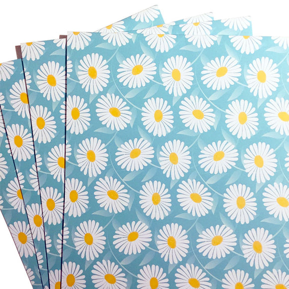 Eco-friendly wrapping paper with daisy print design.
