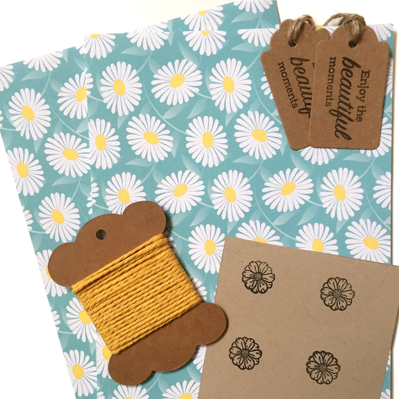 Eco-friendly wrapping paper with daisy patterns, includes multiple sheets.