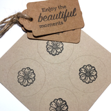 Eco-friendly wrapping paper with daisy patterns, includes tags and string.