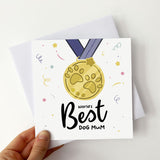Card featuring medal design with "World's Best Dog Mum" inscription.