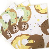 Colorful wrapping paper featuring sloths with doughnuts pattern.