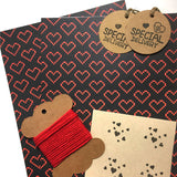 Eco-friendly wrapping paper with pixelated heart design, multiple sheets included.