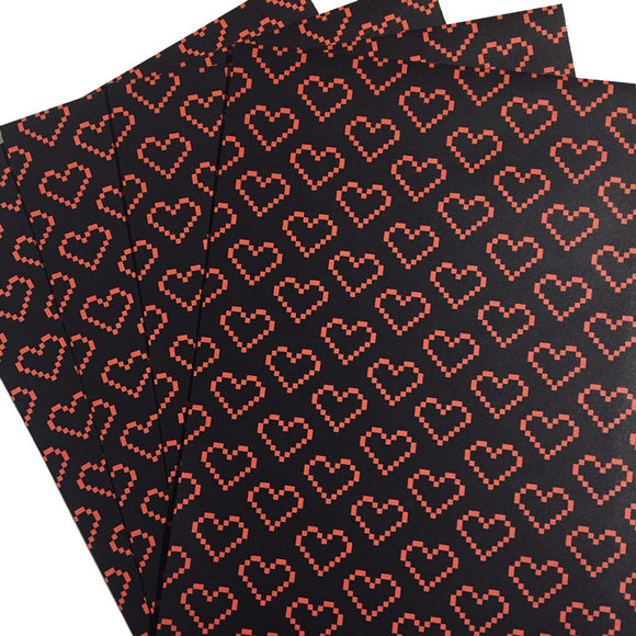 Recyclable wrapping paper with pixelated heart design.