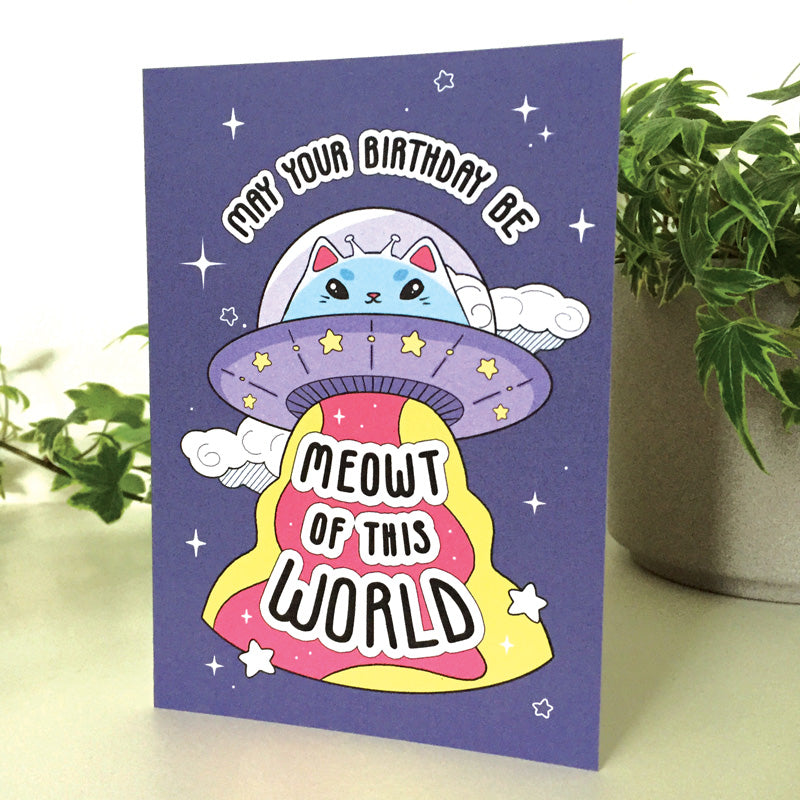 Whimsical space-themed birthday card with a cat in an astronaut suit.