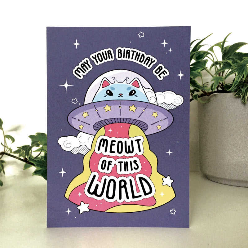Whimsical space-themed birthday card with a cat in an astronaut suit.