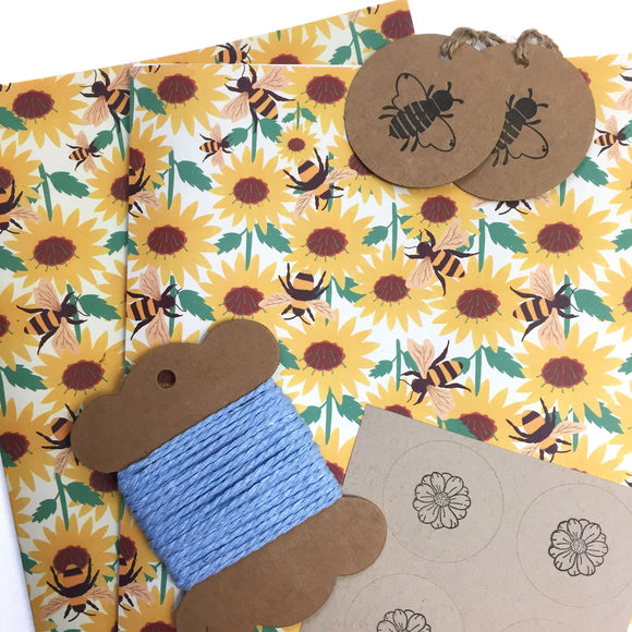 Eco-friendly wrapping paper with bee and sunflower design.