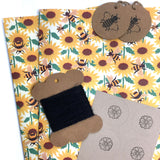 Eco-friendly wrapping paper with bee and sunflower print design.