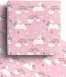 Colorful wrapping paper featuring unicorns and rainbows on a white background.